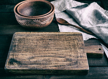 very old empty brown wooden cutting board with handle and empty ceramic bowl, vintage toning Stock Photo - Budget Royalty-Free & Subscription, Code: 400-09226036
