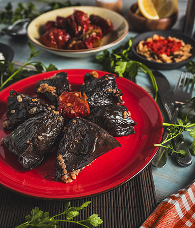 top view plate with stuffed sundried eggplant  and pepper on wooden background Stock Photo - Budget Royalty-Free & Subscription, Code: 400-09220873