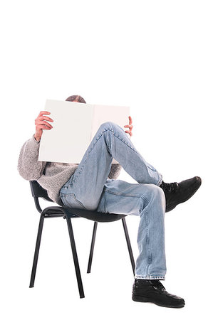 man in a chair with a magazine on a white background Stock Photo - Budget Royalty-Free & Subscription, Code: 400-09221039