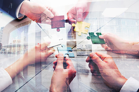 Businessmen working together to build a colored puzzle. Concept of teamwork, partnership, integration and startup. double exposure Stock Photo - Budget Royalty-Free & Subscription, Code: 400-09221114