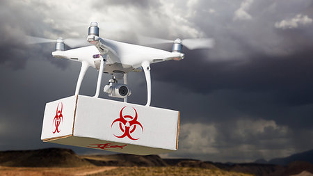 plane rain - Unmanned Aircraft System (UAV) Quadcopter Drone Carrying Package With Biohazard Symbol Label Near Stormy Skies. Stock Photo - Budget Royalty-Free & Subscription, Code: 400-09221214