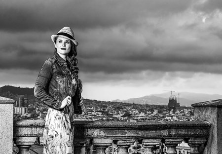 simsearch:400-08415527,k - Perfect evening with stunning view. trendy woman in long dress and straw hat against city panorama of Barcelona, Spain looking into the distance Stock Photo - Budget Royalty-Free & Subscription, Code: 400-09221252