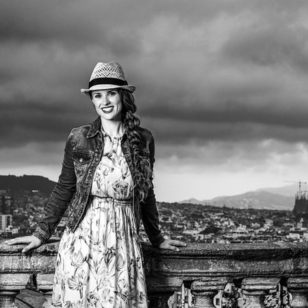 simsearch:400-08415527,k - Perfect evening with stunning view. Portrait of smiling elegant tourist woman in long dress and straw hat against cityscape of Barcelona, Spain Stock Photo - Budget Royalty-Free & Subscription, Code: 400-09221253