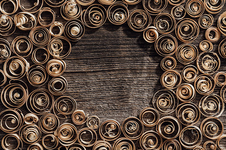 simsearch:400-05385082,k - Wood spiral shavings on a vintage workbench background, blank copyspace at center: carpentry, woodworking and craftsmanship concept Stock Photo - Budget Royalty-Free & Subscription, Code: 400-09221571