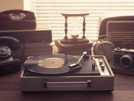 simsearch:400-09221728,k - Vintage retro revival objects and appliances assortment on a table, turntable record player on the foreground Stock Photo - Budget Royalty-Free & Subscription, Code: 400-09221735