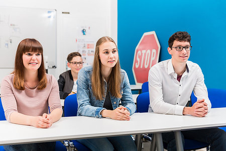 drivers licence - Students in driving lessons listening attentively sitting on benches Stock Photo - Budget Royalty-Free & Subscription, Code: 400-09221807