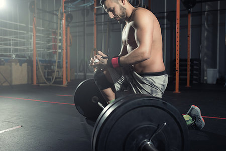 simsearch:400-05104948,k - Determined athletic man works out at the gym with a barbell Stock Photo - Budget Royalty-Free & Subscription, Code: 400-09221968