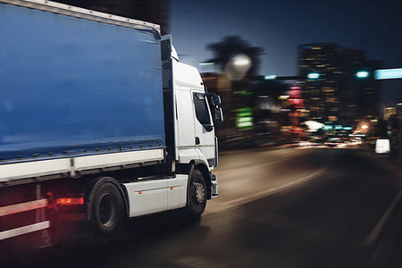 Moving truck on a city road with skyscrapers background Stock Photo - Budget Royalty-Free & Subscription, Code: 400-09222463