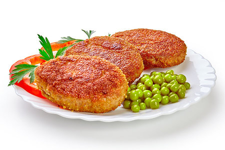 Three fried breaded cutlet with lettuce and parsley isolated on white background Stock Photo - Budget Royalty-Free & Subscription, Code: 400-09222571