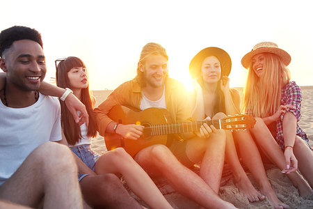 Happy group of friend having party and playing guitar on the beach Stock Photo - Budget Royalty-Free & Subscription, Code: 400-09222670