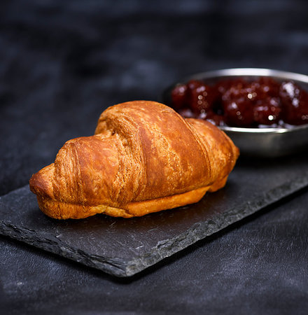 sandwich rustic table - baked croissant on a black graphite background, close up Stock Photo - Budget Royalty-Free & Subscription, Code: 400-09222786