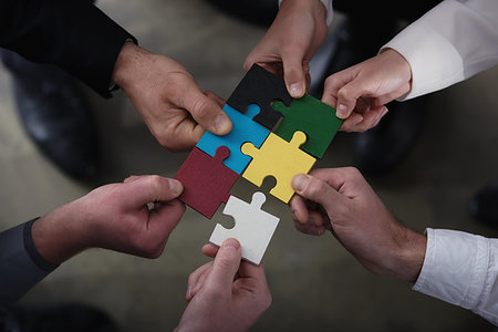 simsearch:400-08669915,k - Businessmen working together to build a colored puzzle. Concept of teamwork, partnership, integration and startup. Stock Photo - Budget Royalty-Free & Subscription, Code: 400-09223129