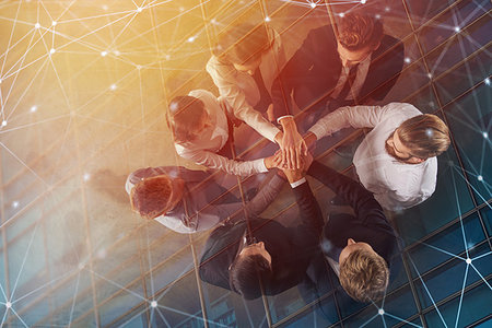 Business people putting their hands together in office with internet network effects. Concept of integration, teamwork and partnership. double exposure Stock Photo - Budget Royalty-Free & Subscription, Code: 400-09223138