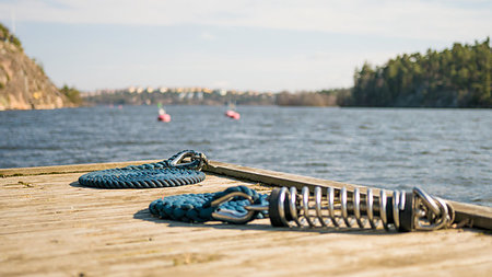rope deck knot - Coastal dock on a rocky area with blue nautical sailing rope for boats and yachts. Photographie de stock - Aubaine LD & Abonnement, Code: 400-09223257