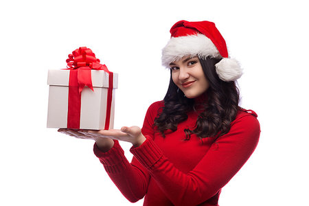 Christmas Santa hat isolated woman portrait hold christmas gift. Smiling happy girl on white background. Stockbilder - Microstock & Abonnement, Bildnummer: 400-09223356