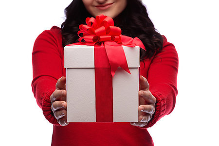 Christmas Santa hat isolated woman portrait hold christmas gift. Smiling happy girl on white background. Stockbilder - Microstock & Abonnement, Bildnummer: 400-09223357