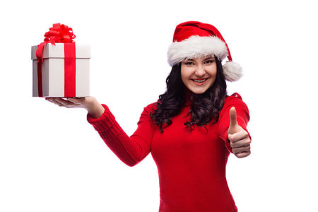 Christmas Santa hat isolated woman portrait hold christmas gift. Smiling happy girl on white background. Foto de stock - Royalty-Free Super Valor e Assinatura, Número: 400-09223358