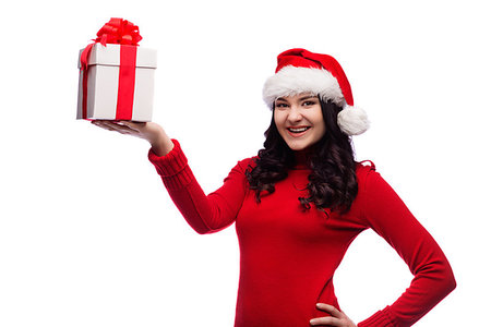 Christmas Santa hat isolated woman portrait hold christmas gift. Smiling happy girl on white background. Foto de stock - Royalty-Free Super Valor e Assinatura, Número: 400-09223359