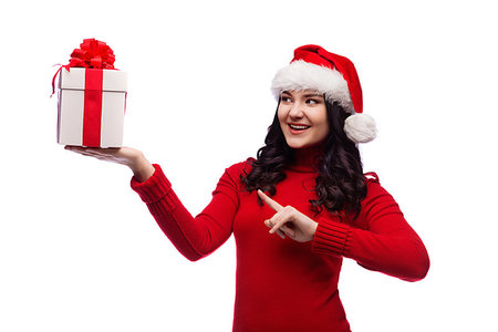 Christmas Santa hat isolated woman portrait hold christmas gift. Smiling happy girl on white background. Stockbilder - Microstock & Abonnement, Bildnummer: 400-09223360
