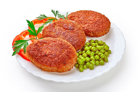 Three fried breaded cutlet with lettuce and parsley isolated on white background Stock Photo - Budget Royalty-Free & Subscription, Code: 400-09223513