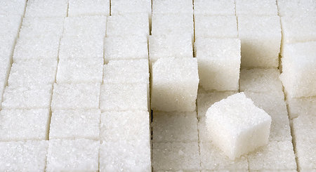 refined sugar - Many cubes of white sugar are spread out in a row Stock Photo - Budget Royalty-Free & Subscription, Code: 400-09223622