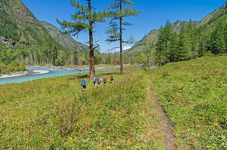 simsearch:400-09274553,k - Group of tourists walking along the bank of the river Kucherla. Altai Mountains, Russia. Sunny summer day. Stock Photo - Budget Royalty-Free & Subscription, Code: 400-09223757