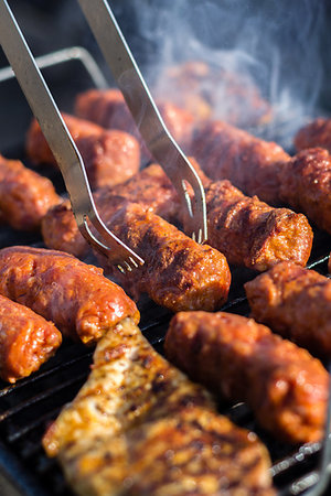 Close up of traditional Romanian food made of pork/beaf meat called mici or mititei fried on mangal barbeque grill Stock Photo - Budget Royalty-Free & Subscription, Code: 400-09237514