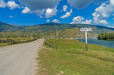 simsearch:400-09274553,k - A road sign with the name of the Tungur village. Altai, Russia. Sunny summer day. Stock Photo - Budget Royalty-Free & Subscription, Code: 400-09237545