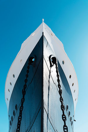 a view of the bow of a moored ship, painted white and navy, against the blue sky Stock Photo - Budget Royalty-Free & Subscription, Code: 400-09238373