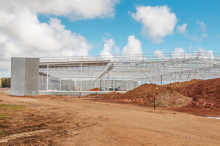 earthwork - construction site of modern shopping centre against blue sky Stock Photo - Budget Royalty-Free & Subscription, Code: 400-09274105