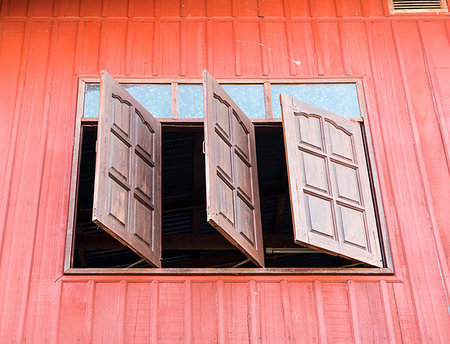 Wooden window is opened from the second floor of the countryside house. Foto de stock - Royalty-Free Super Valor e Assinatura, Número: 400-09274124