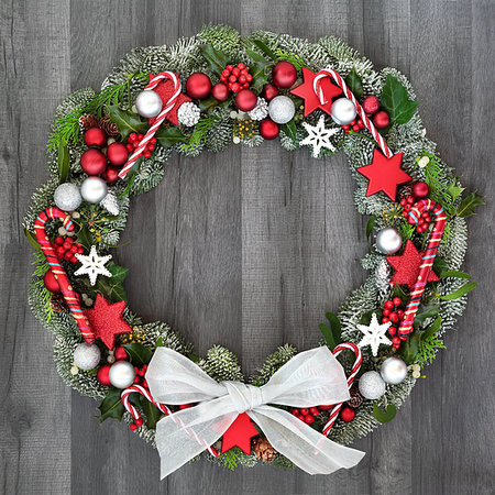 simsearch:400-07614285,k - Christmas and winter wreath with candy canes, bow, bauble decorations, holly, mistletoe, ivy and spruce fir on rustic grey wood  background. Stock Photo - Budget Royalty-Free & Subscription, Code: 400-09274157