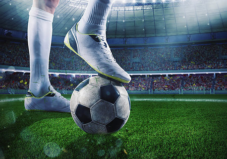 simsearch:400-04766413,k - Soccer player with soccerball on the lawn of a stadium ready for the match Foto de stock - Royalty-Free Super Valor e Assinatura, Número: 400-09274239