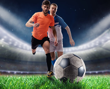 simsearch:400-09032434,k - Soccer players with soccerball on the lawn of a stadium Stockbilder - Microstock & Abonnement, Bildnummer: 400-09274231