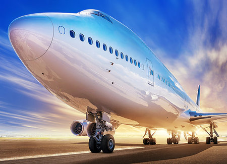 modern airliner on a runway against a sunset Stock Photo - Budget Royalty-Free & Subscription, Code: 400-09274241