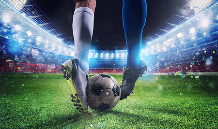 simsearch:400-09032434,k - Soccer players with soccerball at the illuminated stadium during the match Stockbilder - Microstock & Abonnement, Bildnummer: 400-09274464