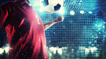 simsearch:400-09083466,k - Football scene with football player stopping the ball during a match Foto de stock - Super Valor sin royalties y Suscripción, Código: 400-09274576