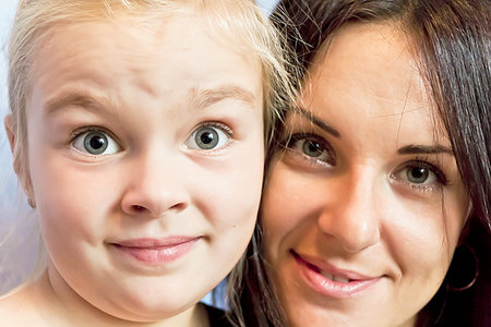 disapproving black woman - Portrait of cute blond daughter with brunette mother Stock Photo - Budget Royalty-Free & Subscription, Code: 400-09274616