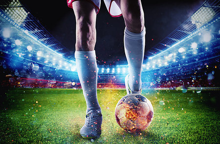 simsearch:400-06513403,k - Soccer player with soccerball on fire at the illuminated stadium during the match Stock Photo - Budget Royalty-Free & Subscription, Code: 400-09274635