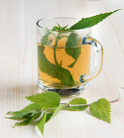 dead nettle - Nettle tea on the wood background leaves in the cup Stock Photo - Budget Royalty-Free & Subscription, Code: 400-09275382