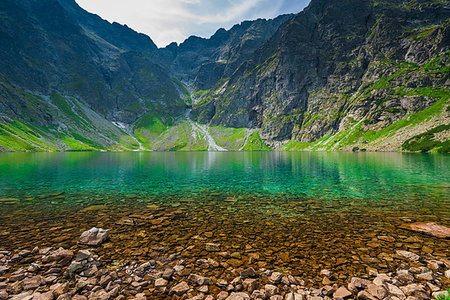 emerald spring - a cold picturesque mountain lake  Czarny Staw in the high Tatra mountains in Poland Photographie de stock - Aubaine LD & Abonnement, Code: 400-09275559