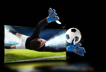 simsearch:400-09032434,k - Soccer player comes out of the tv to catch the ball Stockbilder - Microstock & Abonnement, Bildnummer: 400-09273575