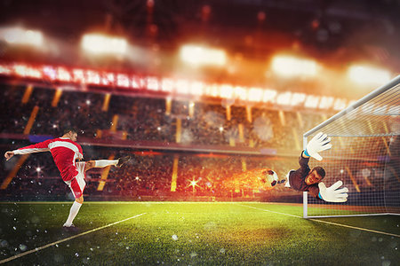 Football scene with a player who kicks a fiery ball into the opponent goal Stock Photo - Budget Royalty-Free & Subscription, Code: 400-09273674