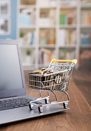 simsearch:400-04763487,k - Shopping cart full of money and laptop on a wooden desktop: e-commerce, e-payments and online shopping concept Foto de stock - Royalty-Free Super Valor e Assinatura, Número: 400-09273818