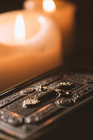 prayer candle and cross - Precious old Bible and lit candles in the Church: Christianity and faith concept Stock Photo - Budget Royalty-Free & Subscription, Code: 400-09273834