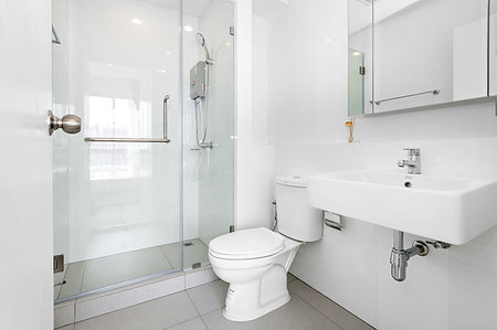 Very clean white bathroom in condominium Stock Photo - Budget Royalty-Free & Subscription, Code: 400-09273909