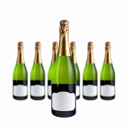 simsearch:614-06623315,k - Champagne bottles with blank label for add text, over a white background. Focus at front Photographie de stock - Aubaine LD & Abonnement, Code: 400-03908256