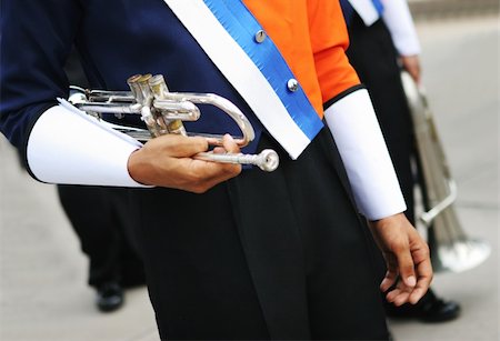 Close-up of a band member holding a trumpet. Stock Photo - Budget Royalty-Free & Subscription, Code: 400-03908544