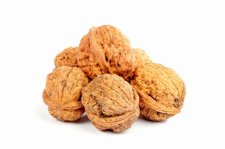 simsearch:400-06954534,k - Some walnuts with shadow over a white background Stock Photo - Budget Royalty-Free & Subscription, Code: 400-03908631