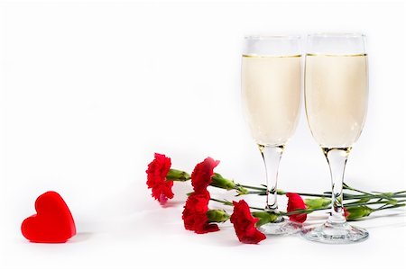 simsearch:614-03903091,k - two glasses of champagne, carnation and red plastic heart on white background with copyspace Stock Photo - Budget Royalty-Free & Subscription, Code: 400-03908765